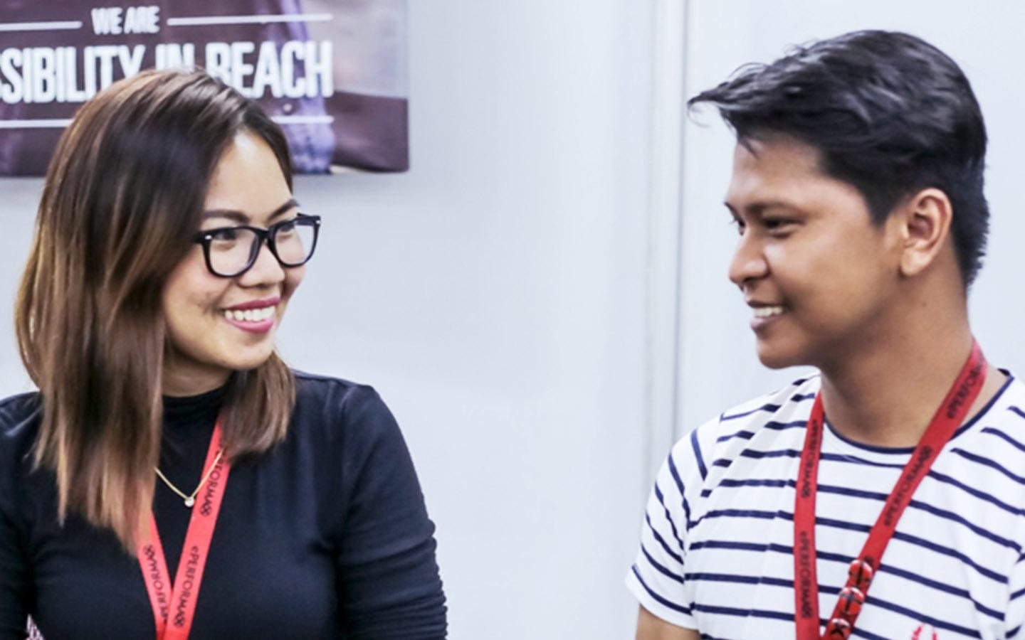 Contact center Philippines agents having discussion with coworkers