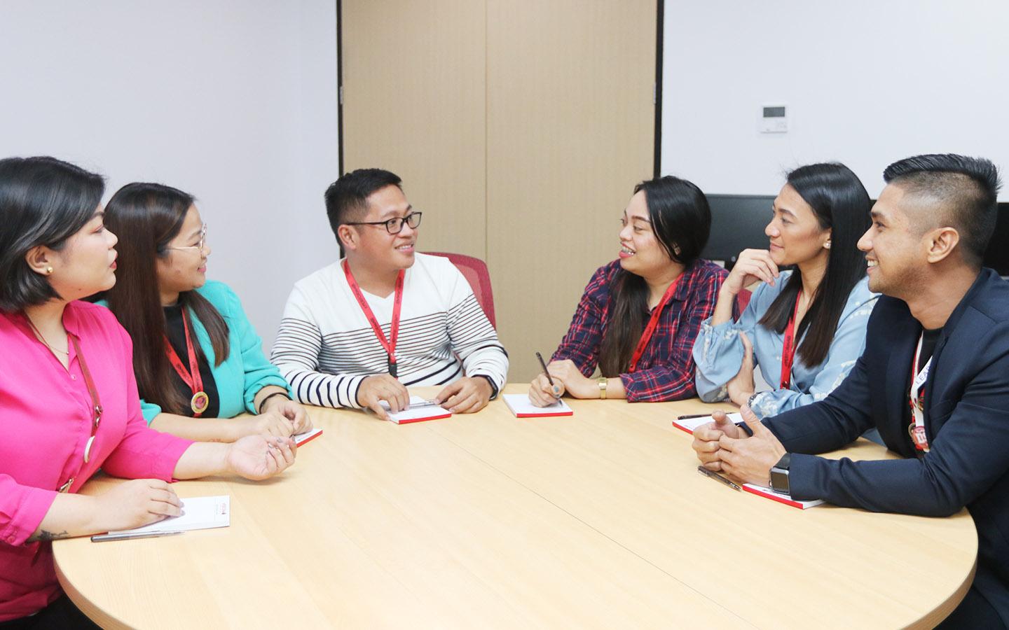 Philippines call center outsourcing team meeting in an office setting